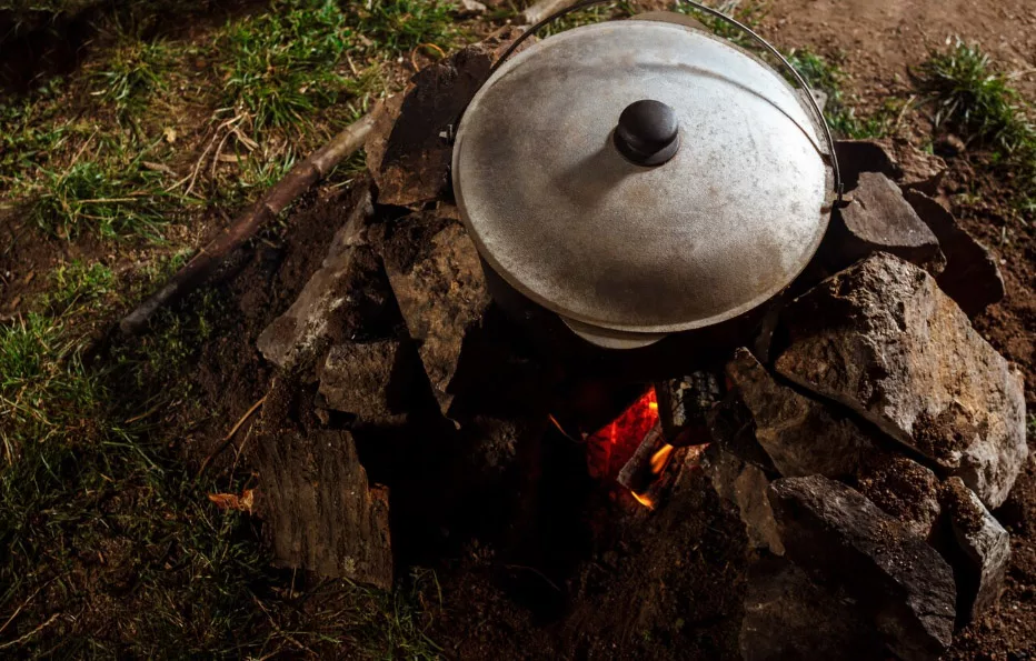 Camp cuisine: Stove, pots, utensils.